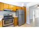 Galley kitchen boasts stainless steel appliances and convenient access to the dining area at 4117 S Semoran Blvd # 17, Orlando, FL 32822