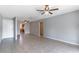 Open living room with tile floors connecting to a view of the kitchen at 4117 S Semoran Blvd # 17, Orlando, FL 32822