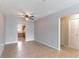 Inviting living room with tile flooring, ceiling fan, and easy access to the kitchen at 4117 S Semoran Blvd # 17, Orlando, FL 32822