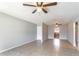 Spacious living room featuring tile floors and ceiling fans for a comfortable living space at 4117 S Semoran Blvd # 17, Orlando, FL 32822