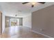 Bright and airy living room with tile flooring and sliding glass doors to outdoor space at 4117 S Semoran Blvd # 17, Orlando, FL 32822
