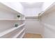 Walk-in closet featuring built-in shelves and hanging rods at 4117 S Semoran Blvd # 17, Orlando, FL 32822
