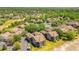Aerial view of the complex surrounded by a well-maintained landscape with mature trees, and community amenities at 420 Summit Ridge Pl # 112, Longwood, FL 32779