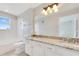 Bathroom featuring a granite-topped vanity with dual sinks, recessed lighting, and a shower/tub combo at 420 Summit Ridge Pl # 112, Longwood, FL 32779