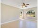 Bright bedroom featuring neutral walls, a ceiling fan, and two windows that provide ample natural light at 420 Summit Ridge Pl # 112, Longwood, FL 32779