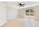 Bright bedroom featuring neutral walls, a ceiling fan, and a window that provides ample natural light at 420 Summit Ridge Pl # 112, Longwood, FL 32779