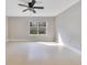 Bright bedroom featuring neutral walls, a ceiling fan, and a window that provides ample natural light at 420 Summit Ridge Pl # 112, Longwood, FL 32779