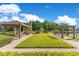 Community greenspace with pergolas, seating, landscaping, and lake views at 420 Summit Ridge Pl # 112, Longwood, FL 32779
