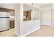 Open-concept kitchen and breakfast bar with granite countertops at 420 Summit Ridge Pl # 112, Longwood, FL 32779