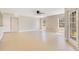 Spacious living room with tile flooring, ceiling fan, and natural light streaming from windows at 420 Summit Ridge Pl # 112, Longwood, FL 32779