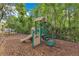 View of the community playground equipment with swings and slide at 420 Summit Ridge Pl # 112, Longwood, FL 32779