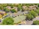 Birds eye view of the tennis courts surrounded by mature landscaping and parking at 420 Summit Ridge Pl # 112, Longwood, FL 32779
