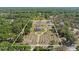 Expansive property featuring a circular driveway leading to a stately home with mature landscaping and a gated entrance at 4232 Spring Ln, Lakeland, FL 33811
