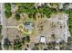 Overhead view of the home, circle driveway, detached garage, and spacious, well-kept lot at 4232 Spring Ln, Lakeland, FL 33811