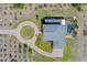 Overhead view of the home, circle driveway, detached garage, and well-kept lot at 4232 Spring Ln, Lakeland, FL 33811