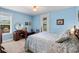 Comfortable bedroom with a bed, desk, and natural light from the window at 4232 Spring Ln, Lakeland, FL 33811