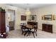 Formal dining room boasts a chandelier, wood furniture, and elegant decor at 4232 Spring Ln, Lakeland, FL 33811