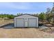 Detached garage with two bay doors and sheltered area on both sides at 4232 Spring Ln, Lakeland, FL 33811
