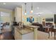 Bright kitchen featuring granite countertops, stainless steel appliances, and a view of the living room at 4232 Spring Ln, Lakeland, FL 33811