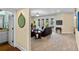 Open living area offers access to a full bath, and outdoor pool through glass doors at 4232 Spring Ln, Lakeland, FL 33811