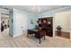 Spacious office with ample storage, a desk, chair, and a light blue color scheme at 4232 Spring Ln, Lakeland, FL 33811
