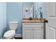 Stylish powder room with granite countertop and modern fixtures at 4232 Spring Ln, Lakeland, FL 33811