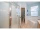Bright bathroom featuring a shower, soaking tub, and tiled flooring at 428 Orista Dr, Davenport, FL 33897