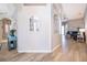 Hallway featuring wood-look floors, neutral paint, arched doorways, and seamless transition to the living room at 428 Orista Dr, Davenport, FL 33897
