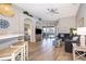 Inviting living room with wood-look flooring, comfortable seating, and access to the outdoor patio area at 428 Orista Dr, Davenport, FL 33897