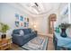 Comfortable living room featuring modern decor, wood floors, and a bright, open layout at 428 Orista Dr, Davenport, FL 33897