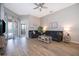 Spacious living room featuring comfortable seating, wood-look flooring, neutral tones, and ample natural light at 428 Orista Dr, Davenport, FL 33897