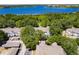Aerial view of condos in a community, near a lake with lush green trees at 4340 S Kirkman Rd # 901, Orlando, FL 32811