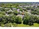 An aerial view of the community with mature trees, landscaping, and nearby shopping at 4340 S Kirkman Rd # 901, Orlando, FL 32811