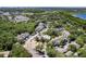 Aerial view showcasing the community pool, lush trees, and landscaping at 4340 S Kirkman Rd # 901, Orlando, FL 32811