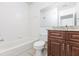 Well-lit bathroom featuring a granite vanity and tile flooring at 4340 S Kirkman Rd # 901, Orlando, FL 32811