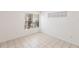 Bright bedroom with two windows, tile floor, and neutral paint at 4340 S Kirkman Rd # 901, Orlando, FL 32811