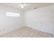 A bright bedroom features a ceiling fan, and ceramic tile flooring at 4340 S Kirkman Rd # 901, Orlando, FL 32811