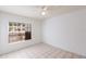 The tiled bedroom features a window for natural light and a ceiling fan at 4340 S Kirkman Rd # 901, Orlando, FL 32811