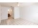 The bright bedroom has tile floors and an open door to the bathroom at 4340 S Kirkman Rd # 901, Orlando, FL 32811
