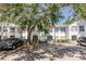 Inviting condominium exterior with multiple units, mature trees, and convenient parking available for residents and visitors at 4340 S Kirkman Rd # 901, Orlando, FL 32811