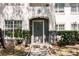 Inviting condo front door with a stylish gray paint, modern hardware, and well-maintained landscaping at 4340 S Kirkman Rd # 901, Orlando, FL 32811