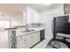 Bright kitchen offering white cabinets, stainless steel sink, and tile flooring at 4340 S Kirkman Rd # 901, Orlando, FL 32811