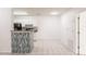 Efficient kitchen with white cabinets, modern appliances, breakfast bar, and seamless connection to the living area at 4340 S Kirkman Rd # 901, Orlando, FL 32811