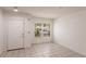 The living room offers bright space with tile floors, large window, and easy access to other rooms at 4340 S Kirkman Rd # 901, Orlando, FL 32811