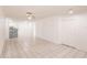 Spacious living room featuring an open layout with tile flooring and access to the kitchen area at 4340 S Kirkman Rd # 901, Orlando, FL 32811
