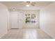 Bright living room featuring tiled floors, a ceiling fan, and a large window to allow natural light at 4340 S Kirkman Rd # 901, Orlando, FL 32811