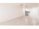 Open concept living room boasts tile flooring and seamless access to the kitchen area for easy living and entertaining at 4340 S Kirkman Rd # 901, Orlando, FL 32811