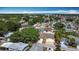 Expansive aerial view showcasing a well-established residential neighborhood with mature trees and diverse home styles at 50989 Highway 27 # 174, Davenport, FL 33897