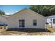 An external shot of the home's backyard with a sliding door at 50989 Highway 27 # 174, Davenport, FL 33897