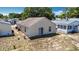 Back exterior view of home with patio and windows at 50989 Highway 27 # 174, Davenport, FL 33897